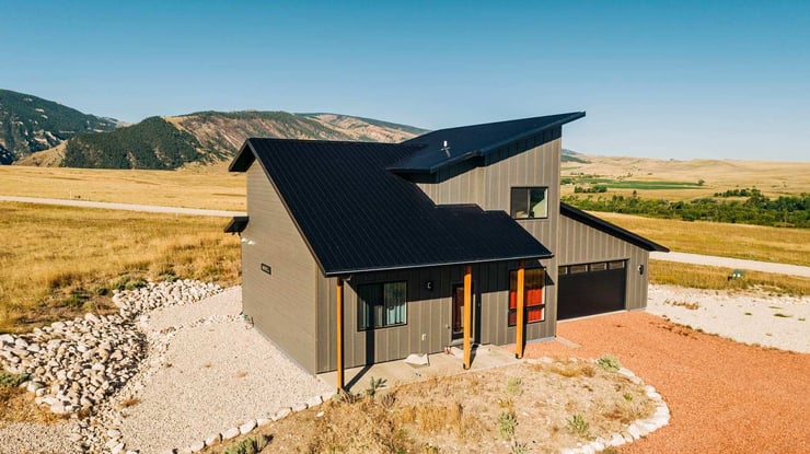 Custom home exterior view in Sheridan, Wyoming with metal roofing