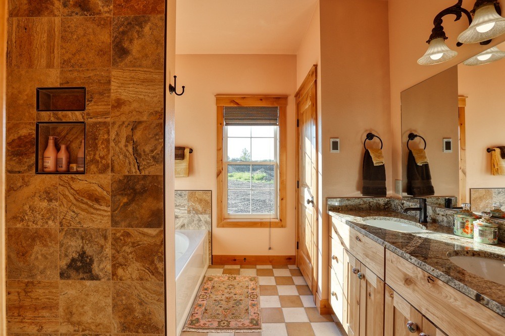 Master bathroom with tub and shower across double vanity