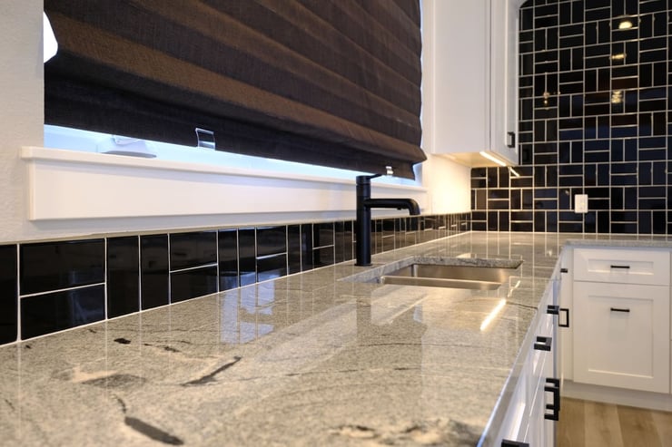 Granite kitchen countertop details by First Choice Builders in Wyoming