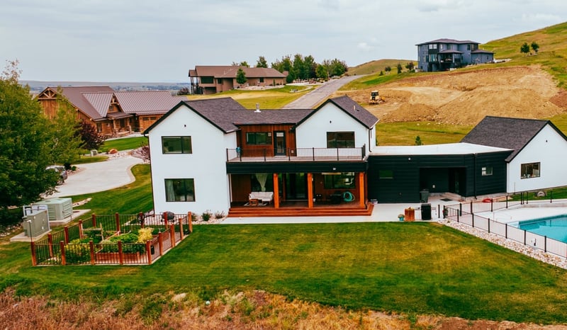 Luxury custom home in Wyoming with pool, deck, and garden