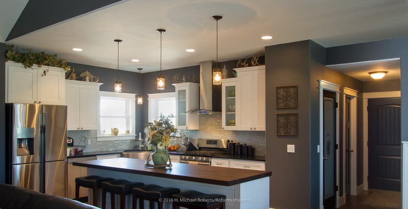 Luxury kitchen in Wyoming custom home with glass tile backsplash