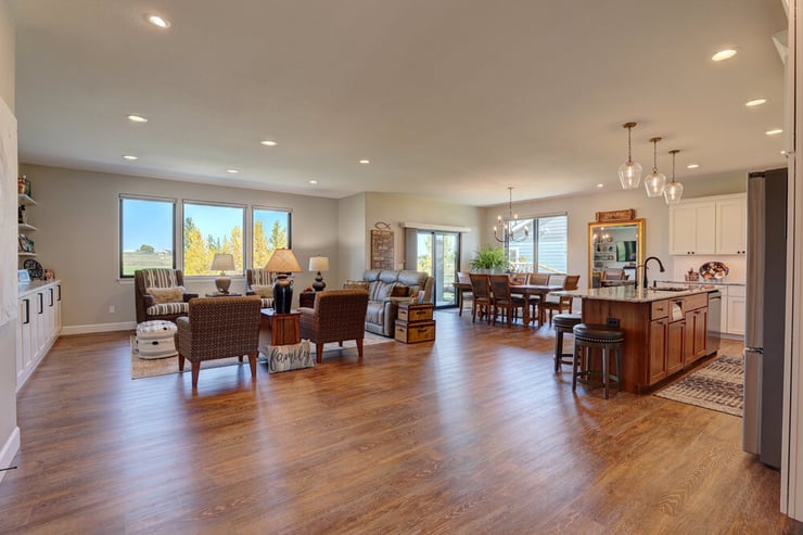 Open floor plan living room and kitchen rustic look in Wyoming custom home