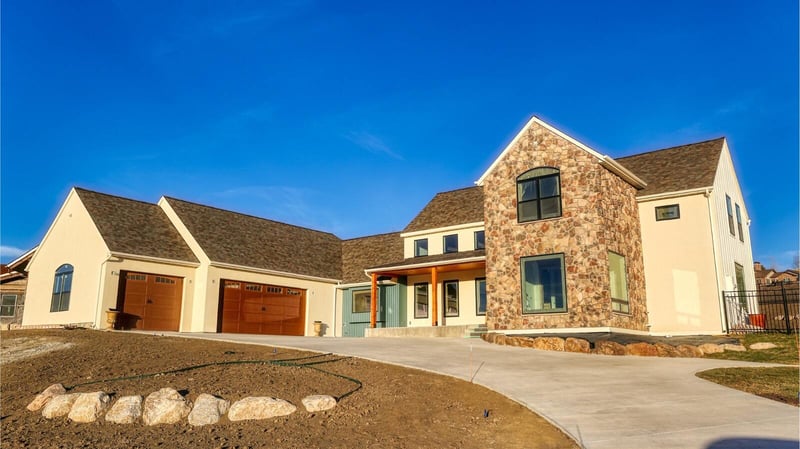 Exterior of custom home build with attached two car garage