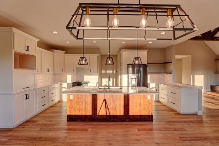 rustic kitchen with pendant lighting and white cabinets in sheridan wyoming-1