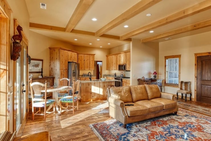 custom home beamed ceiling living room with furniture in Wyoming