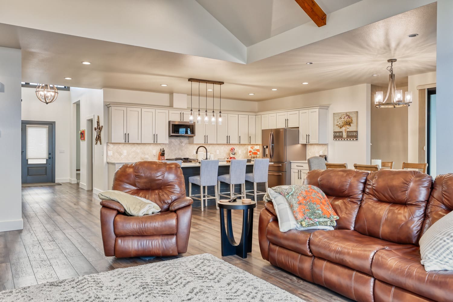 Open concept first floor view of living room and kitchen