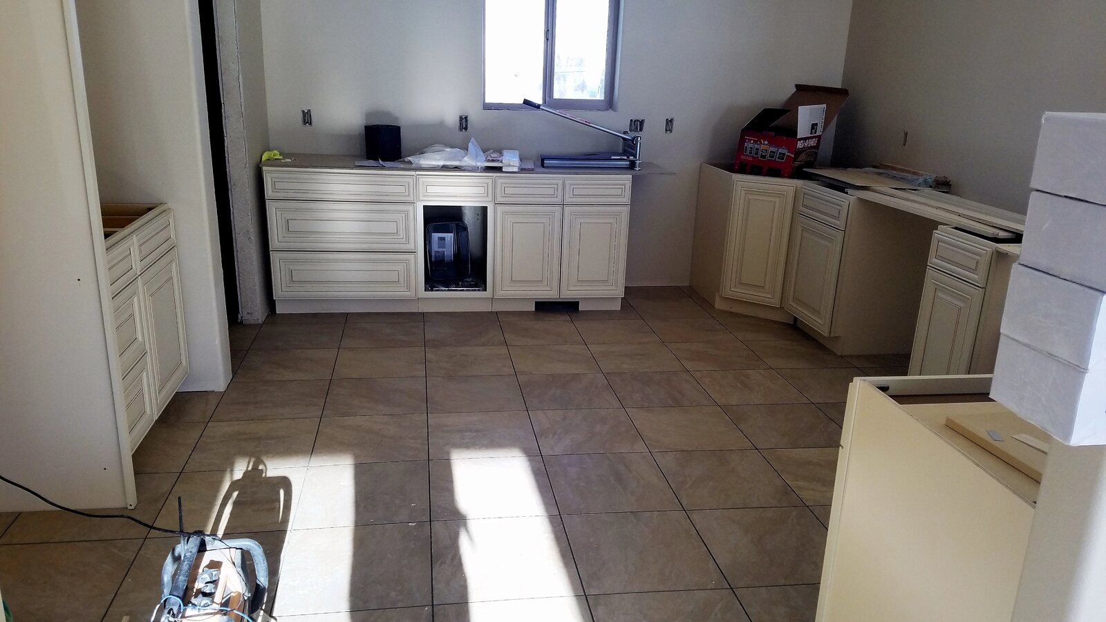 cabinets being installed in custom home kitchen in wyoming