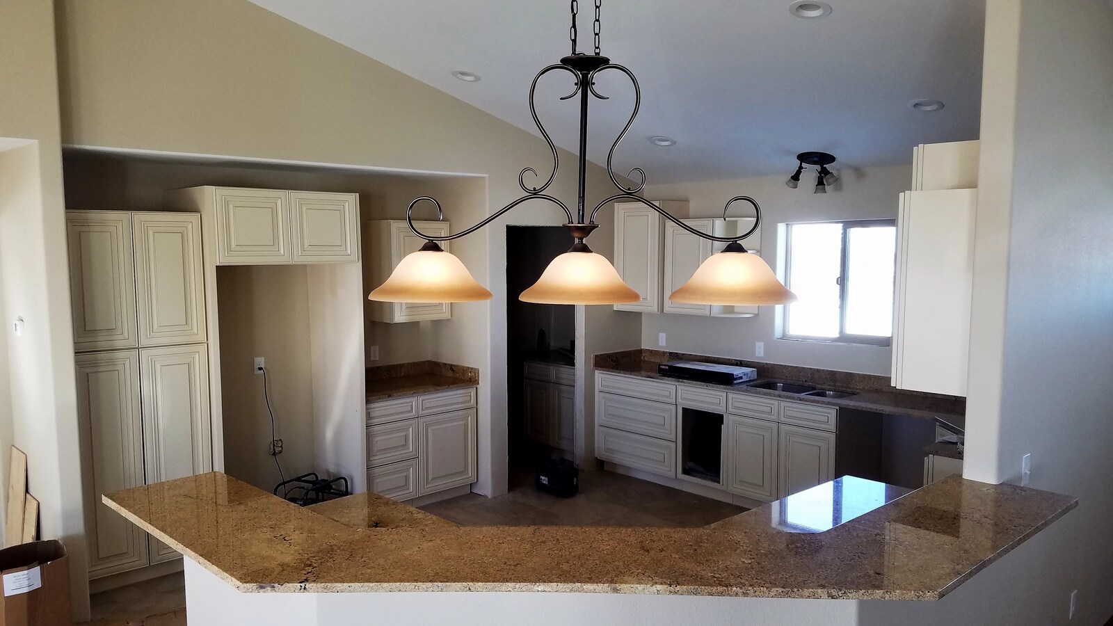 custom home interior kitchen with pendant lighting in wyoming
