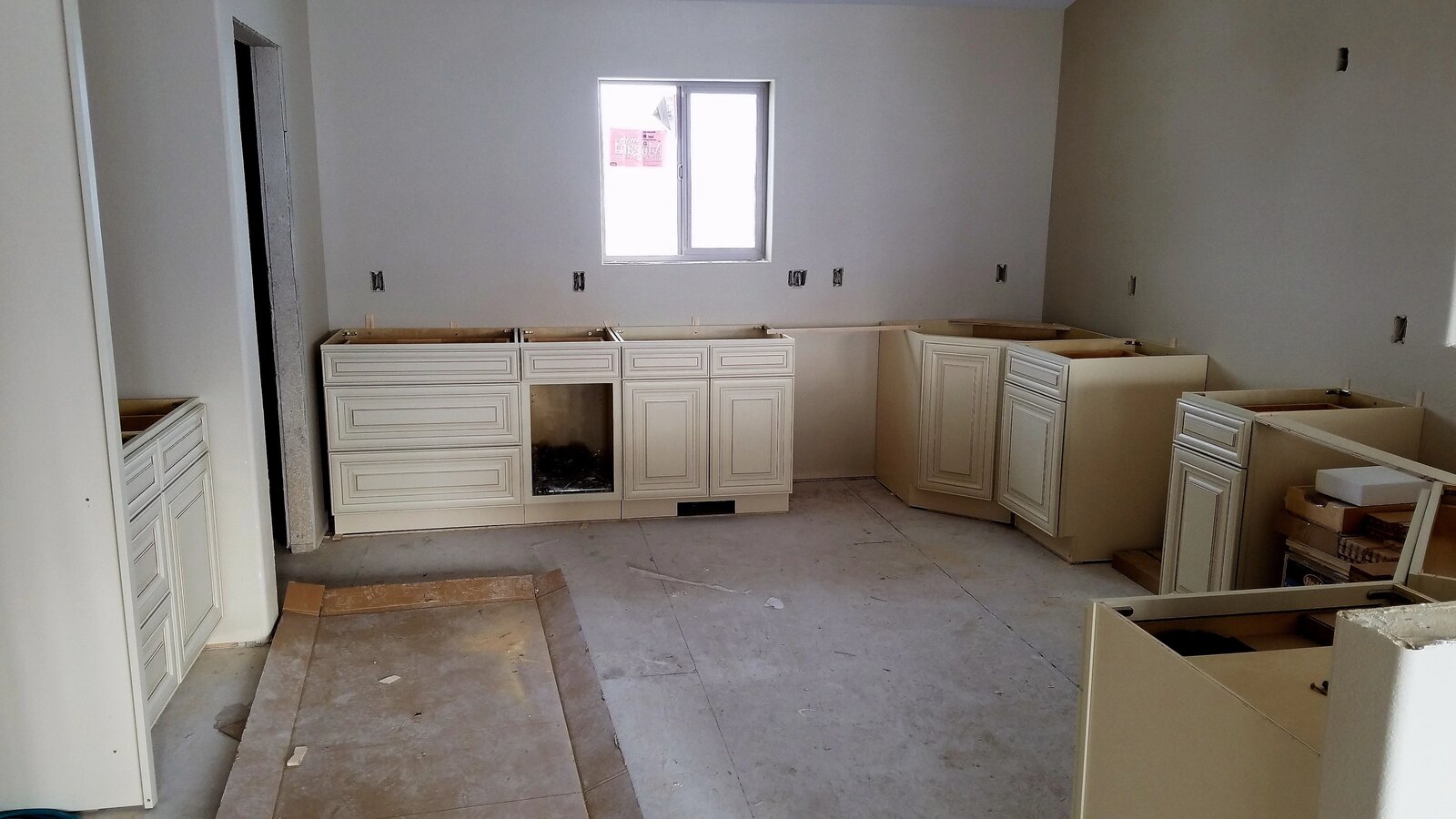 custom home kitchen being built cabinets installed in wyoming