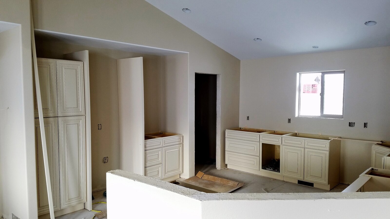 custom home kitchen being built installing cabinets in wyoming