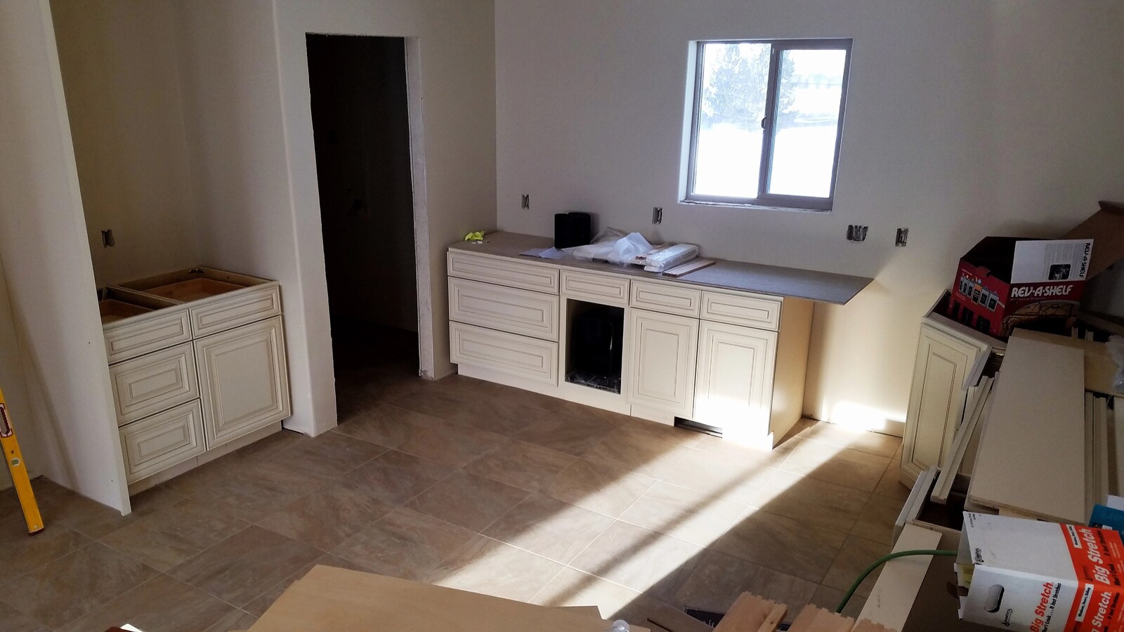custom home kitchen cabinets being installed in wyoming