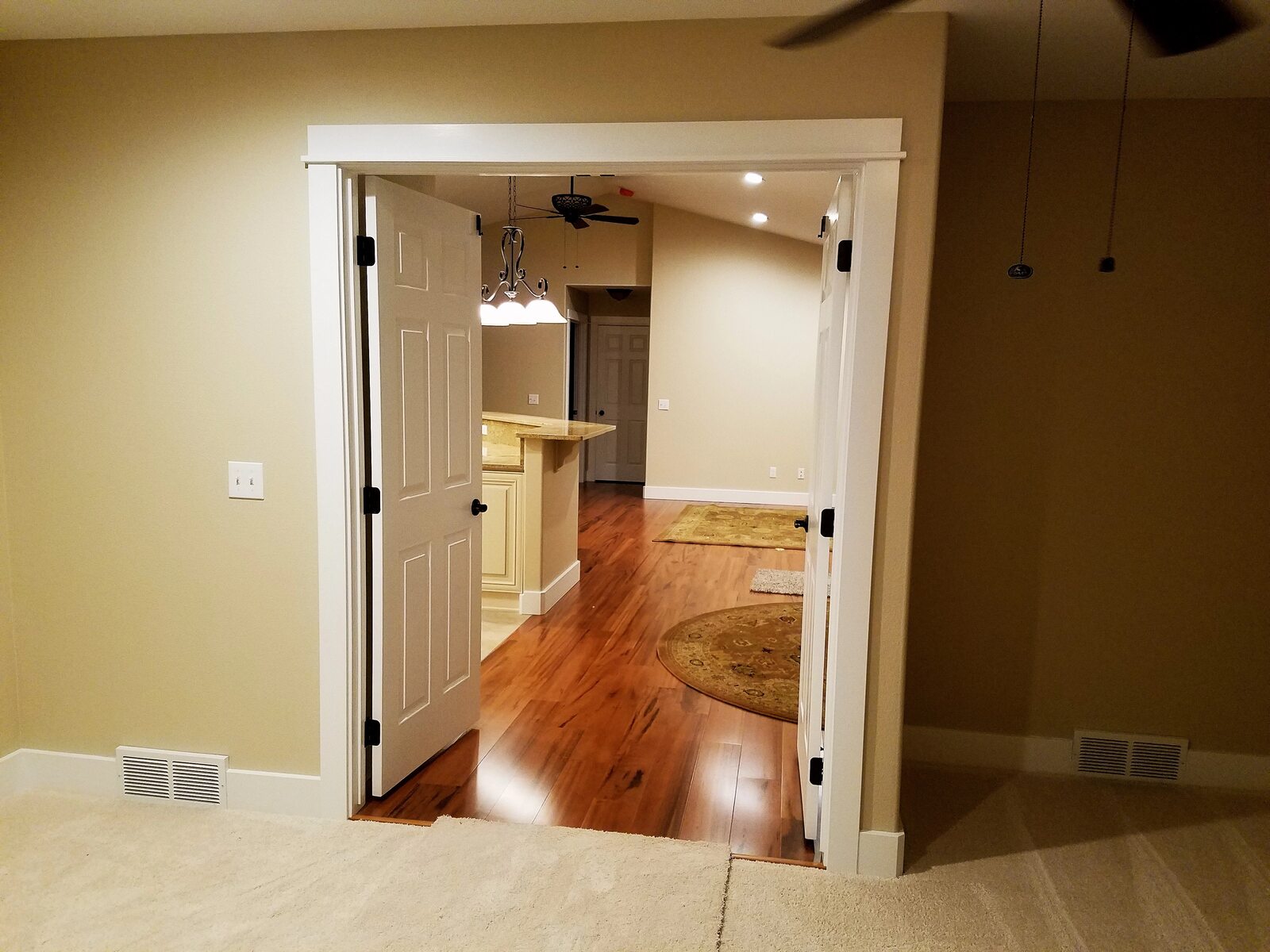 looking through doorway in custom home with wood floor in wyoming