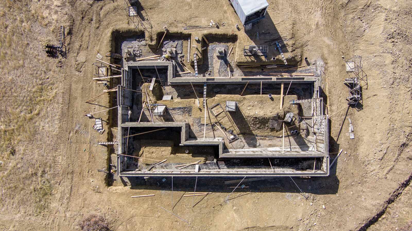 aerial of custom home framing in wyoming