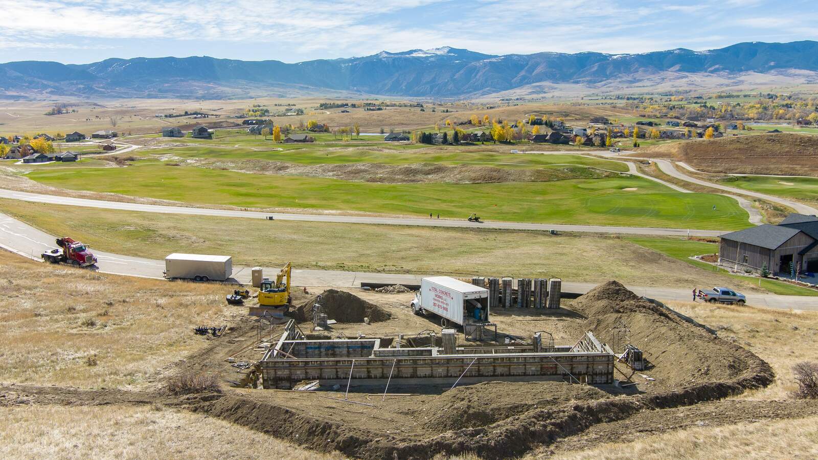custom home being built frame with mountains in background in wyoming