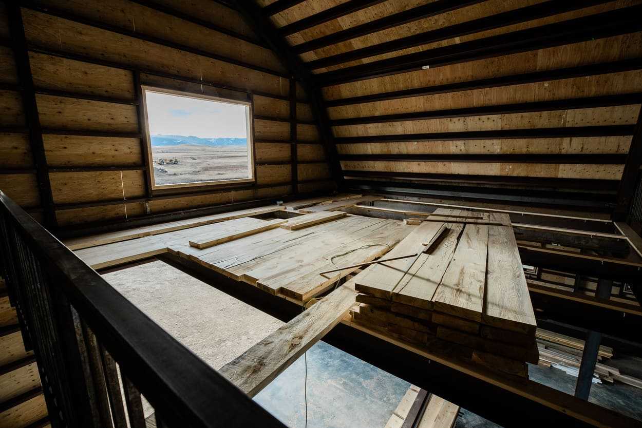 Barn construction with wood paneling down