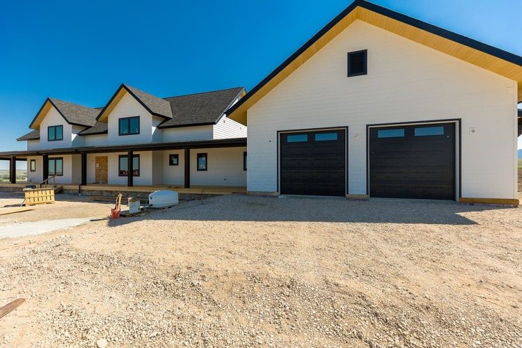 Custom home exterior on Upper Road with two car garage