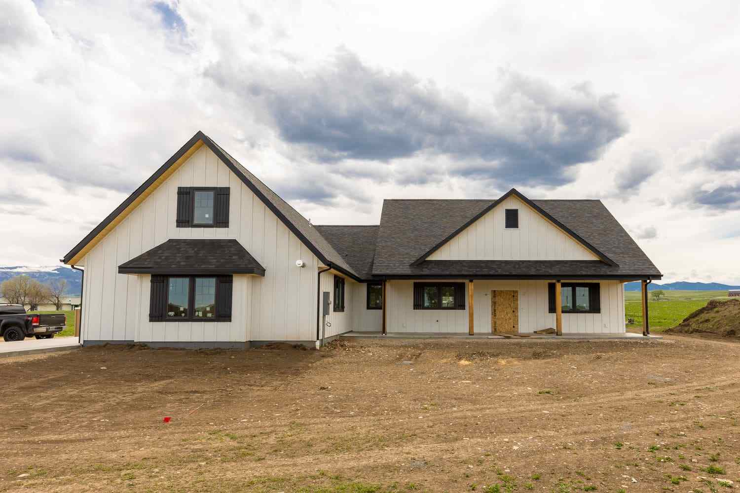 Front exterior of custom home build with gable roofing