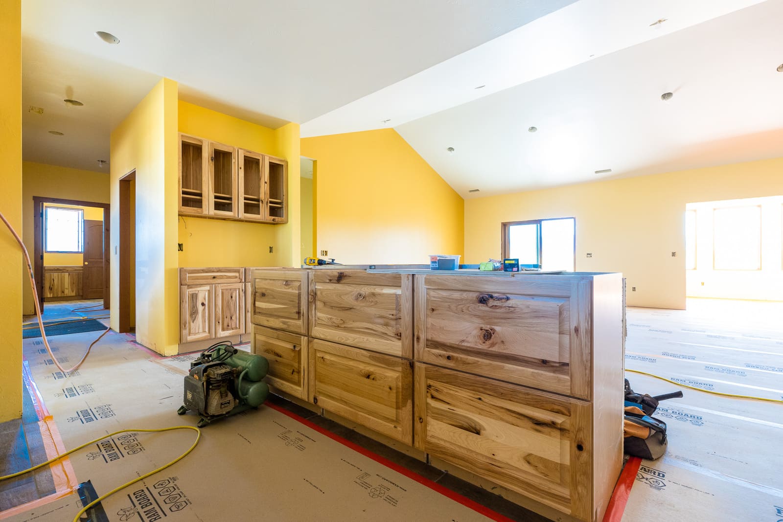 Interior progress of custom home with cabinetry installed