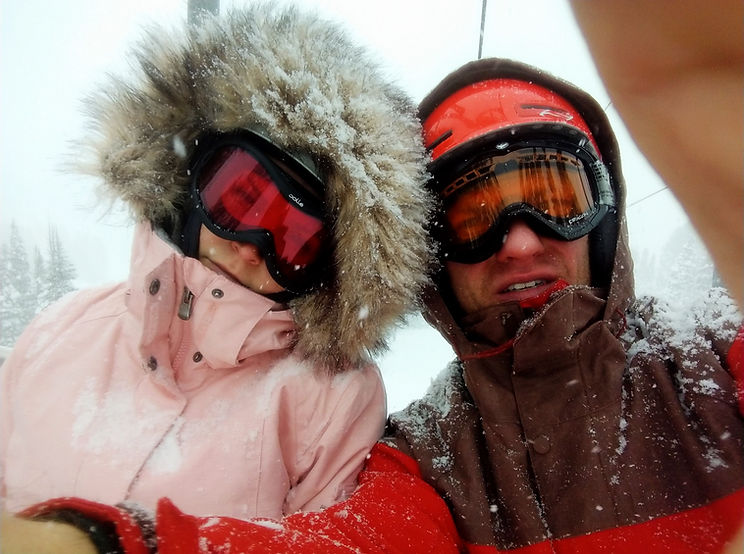 Drew Homola and daughter skiing