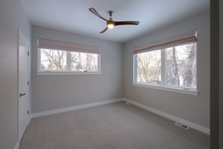 bedroom-interior-of-new-home-build-with-two-windows-and-closet-1