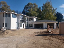 custom-home-exterior-construction-progress-with-siding-being-completed-1