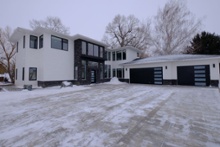 exterior-of-luxury-custom-home-build-with-attached-double-garage-1