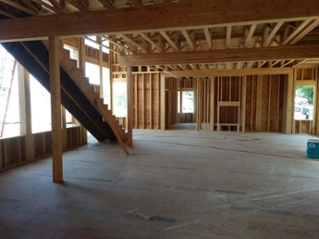 floor-joists-and-stair-case-construction-in-new-home-1