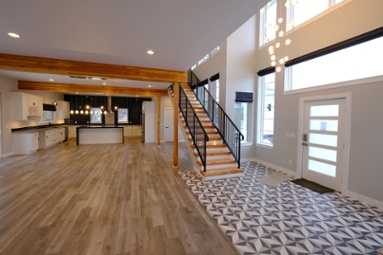 foyer-in-open-concept-custom-home-with-staircase-by-door-1