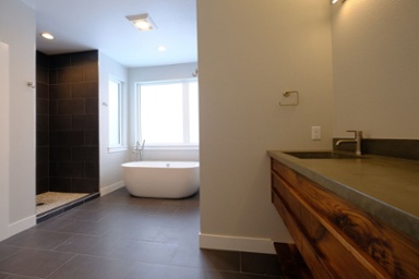 luxury-custom-bathroom-with-walk-in-shower-and-white-soaking-tub-next-to-window-1