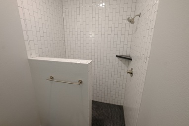white-tiled-walk-in-shower-with-built-in-corner-shelf-1
