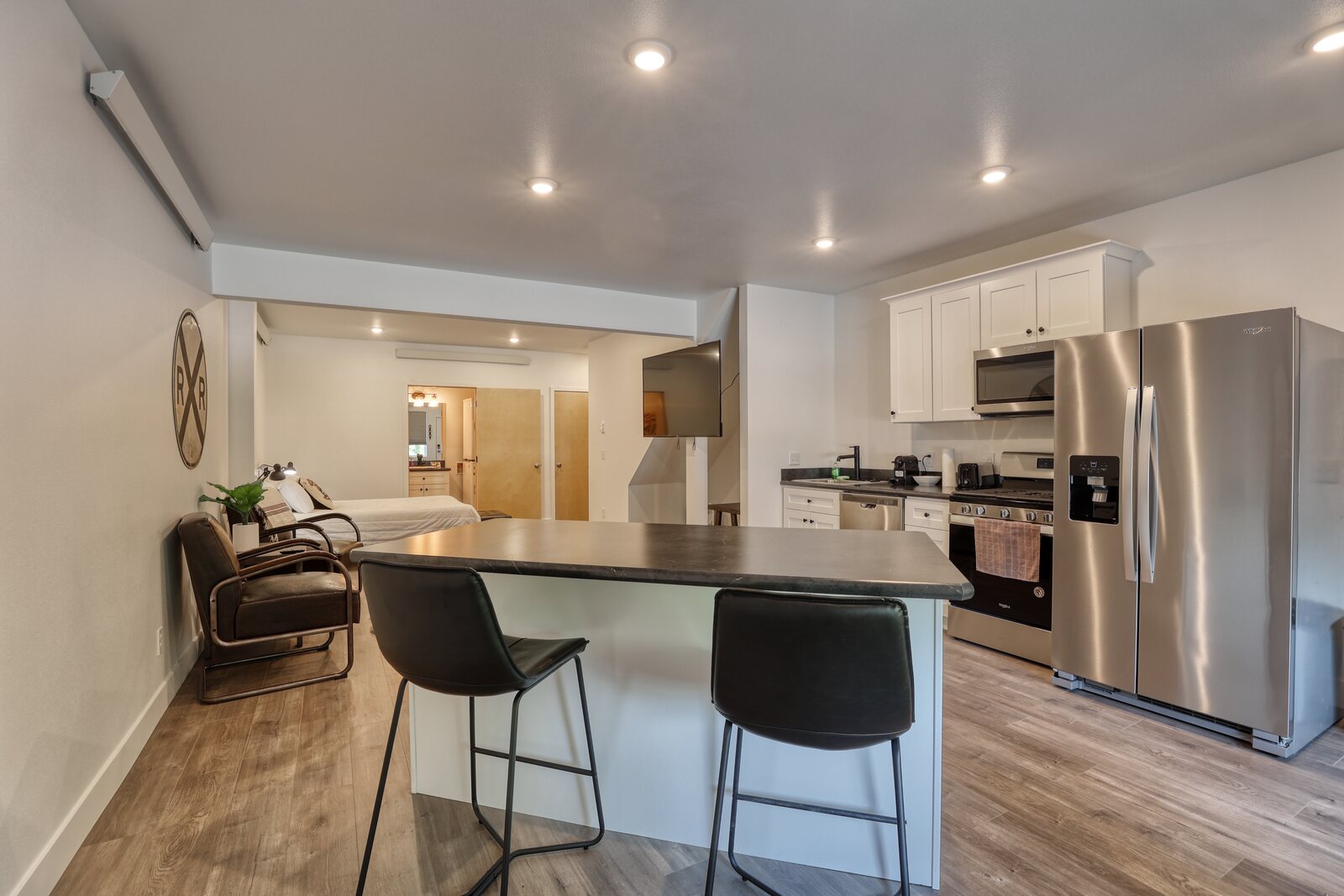 basement kitchen with island and barstools in custom home wyoming