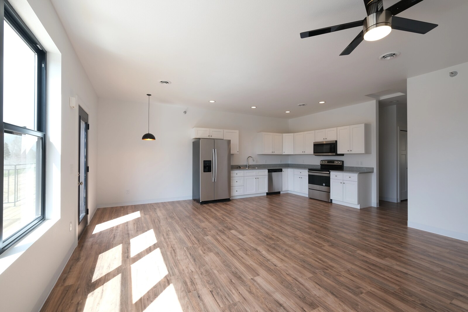 custom home kitchen with wood flooring in wyoming