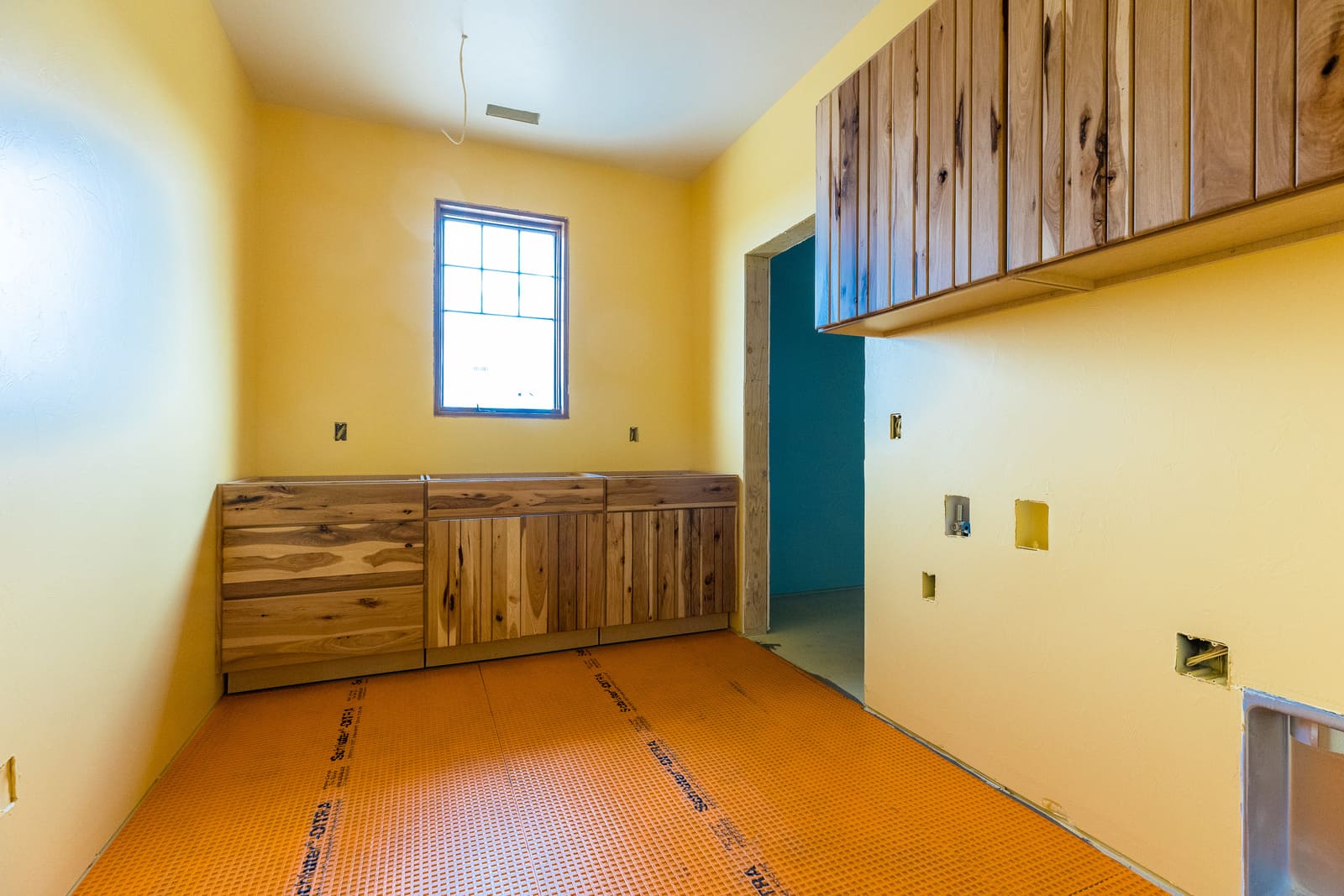 Custom wood cabinetry installation in kitchen