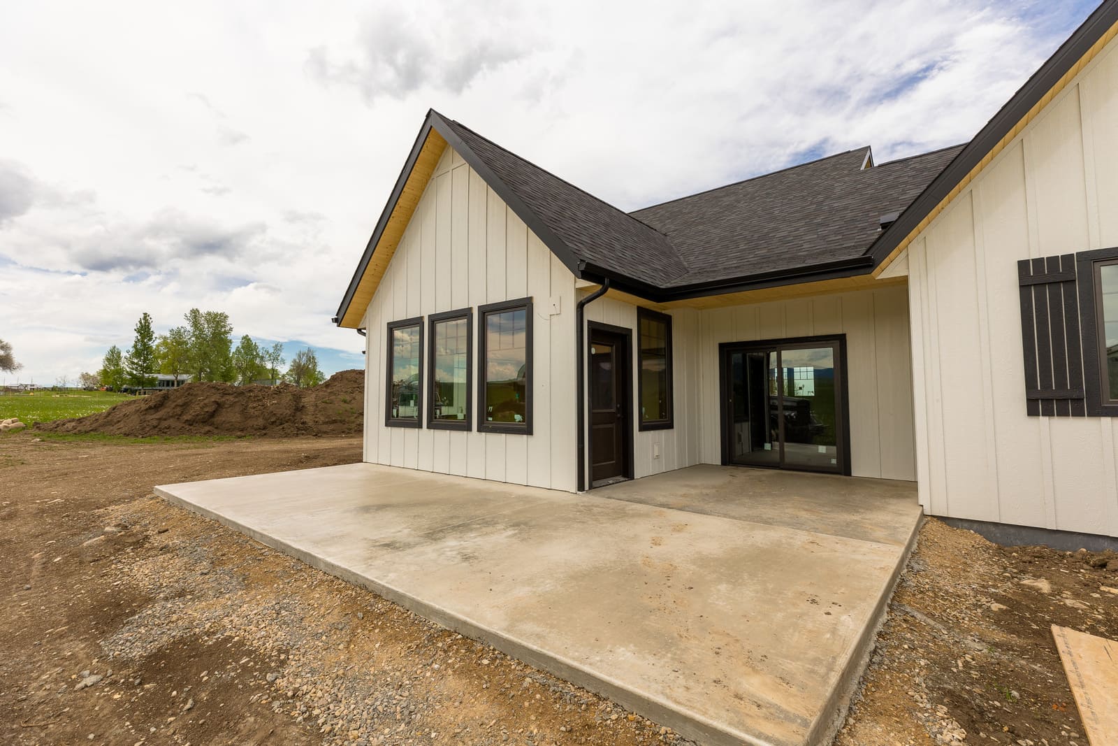 Exterior of new construction home with black window trim