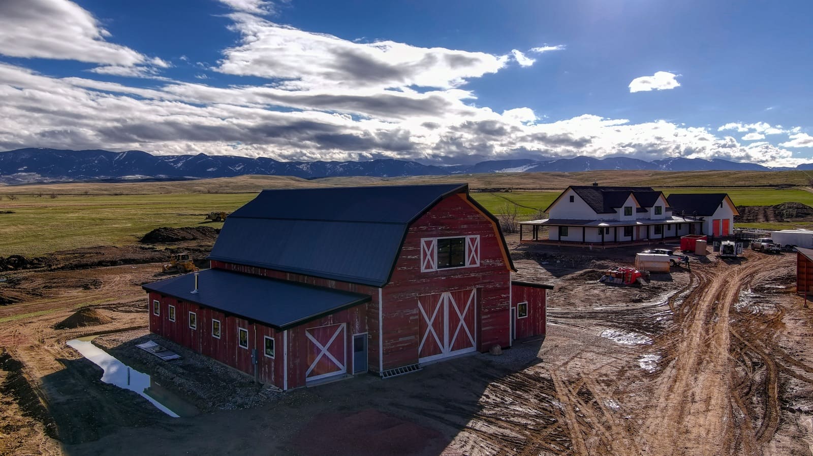 Exterior view of barn and custom home