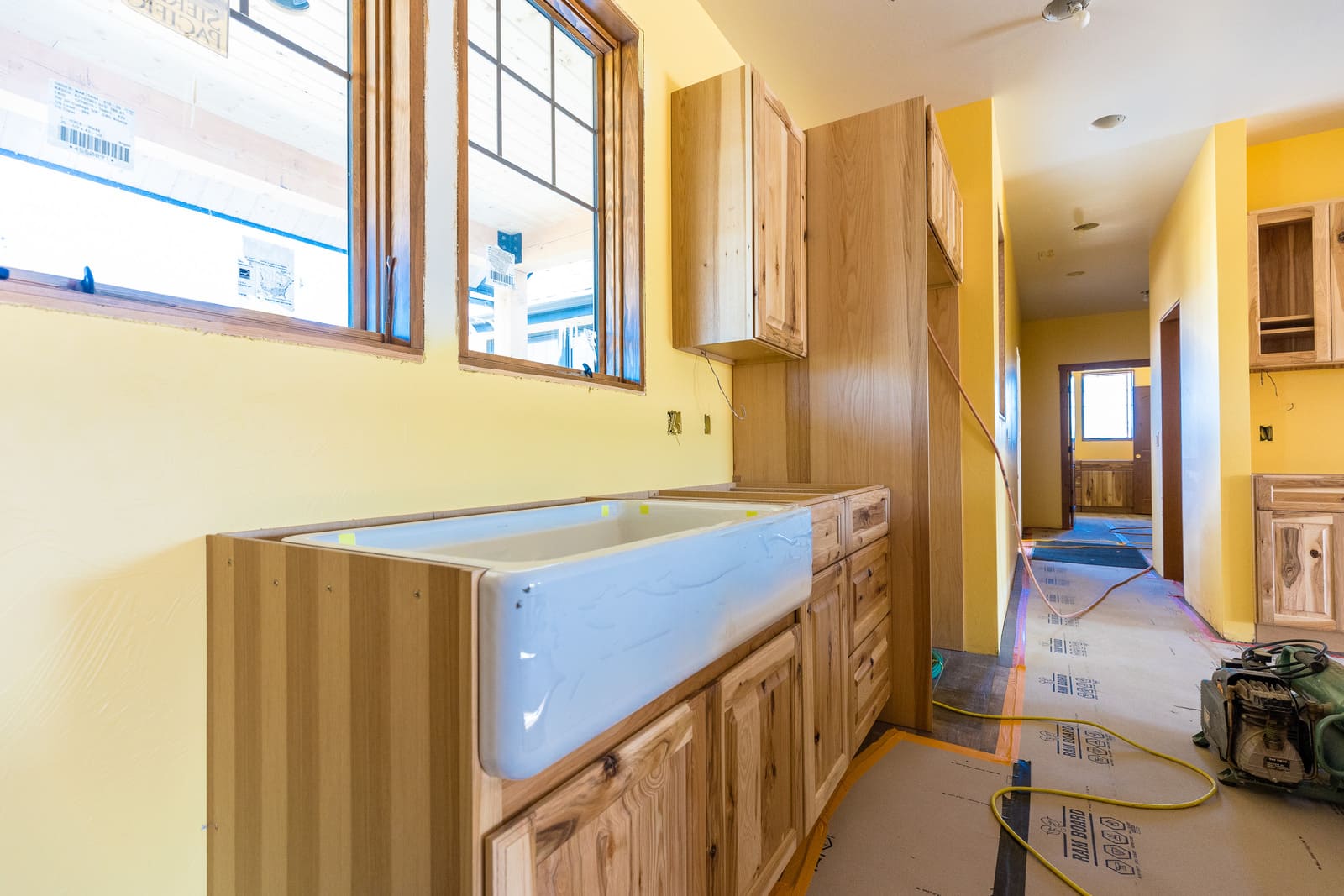 Farmhouse style custom kitchen progress with sink installed