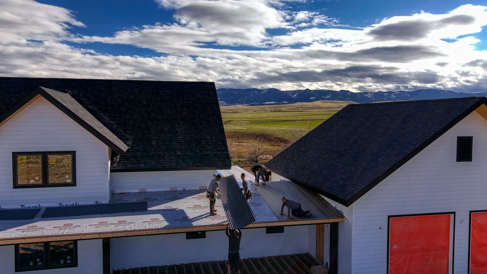 First Choice team working on roof of custom home