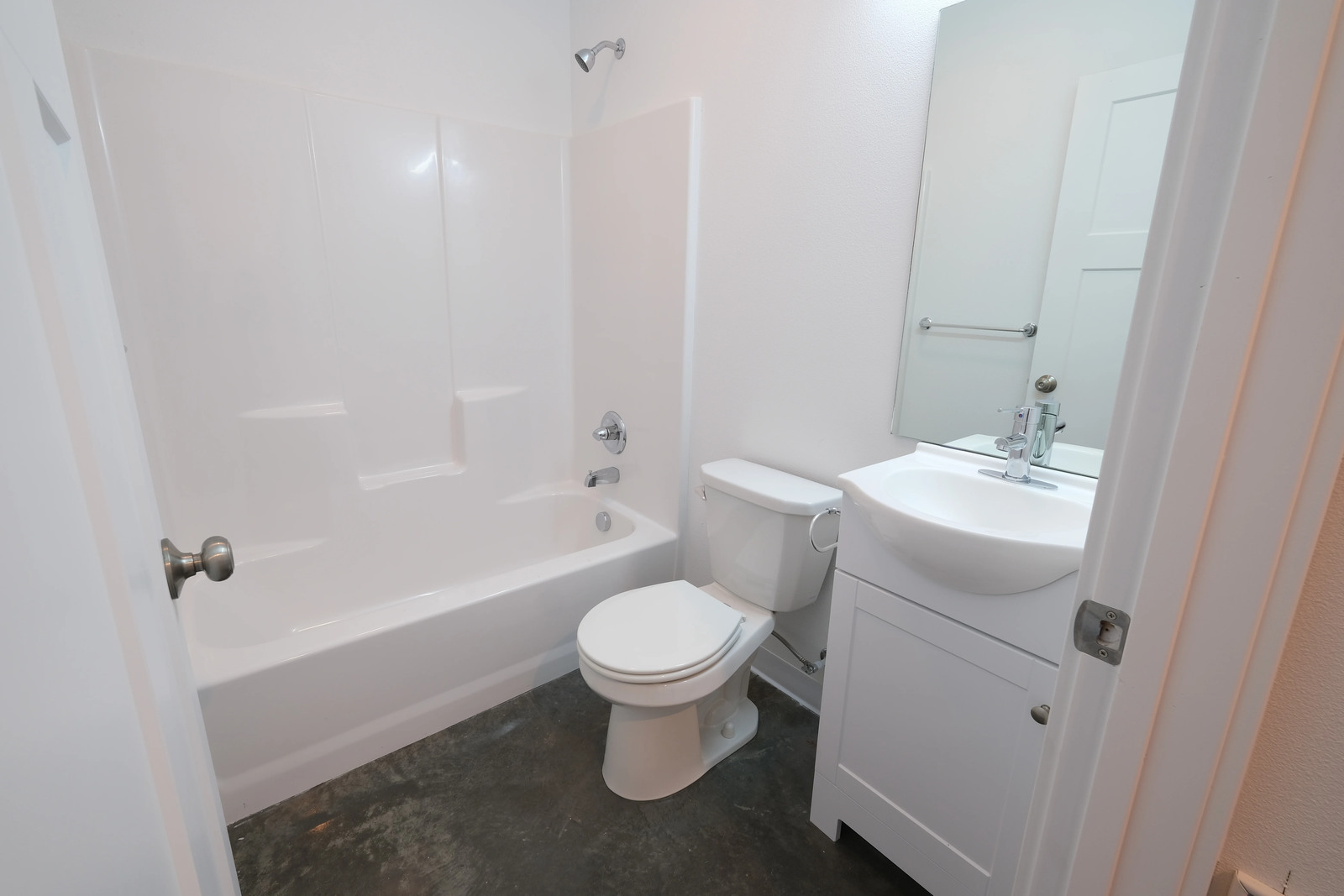 white bathroom and tub with shower in wyoming custom home