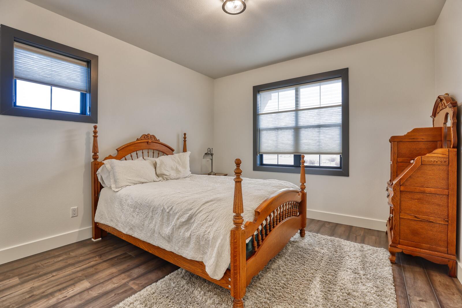 wood bed frame in custom home bedroom in wyoming