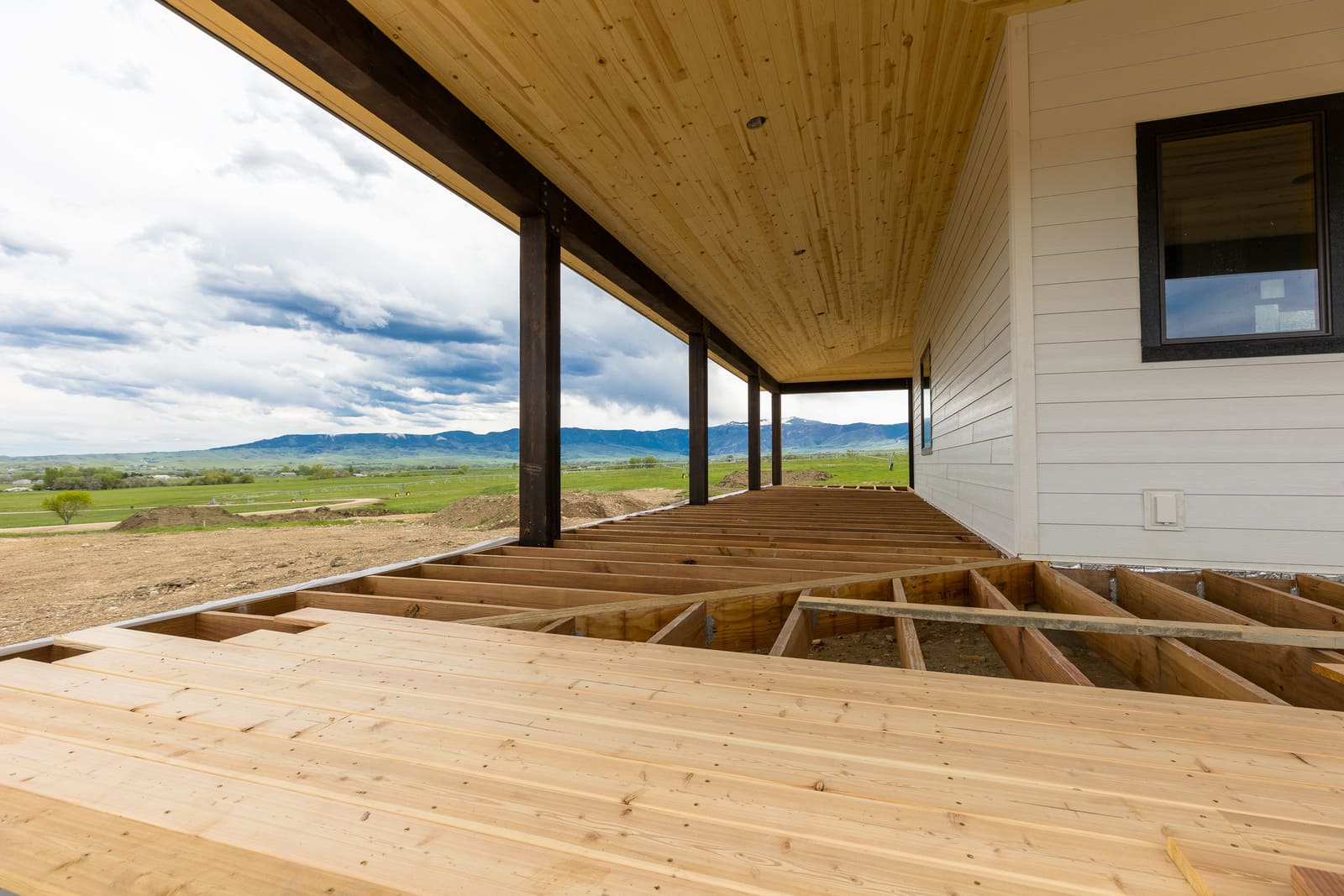 Wood flooring installation on custom porch